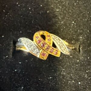 Elegant Gold and Silver ‘Breast Cancer Ribbon’ Ring. Size 9. Never been worn.
